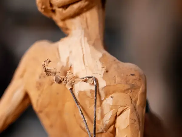 high-angle-hand-holding-sculpting-tool -  - Parallel Visions